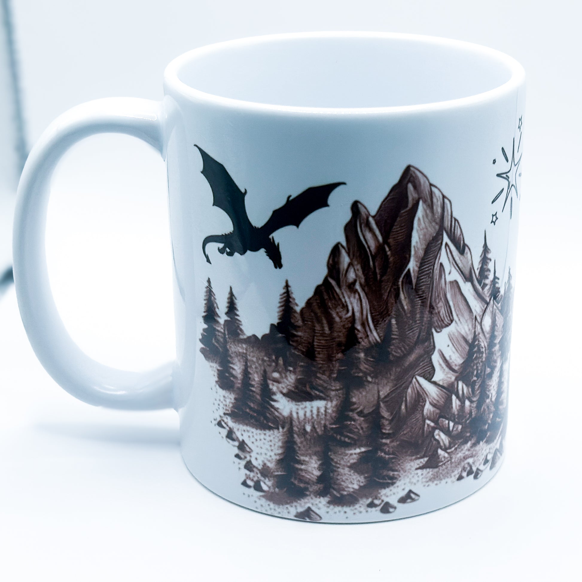 ADHD & Dragons Mug featuring a dragon flying over mountains and pine trees with stars