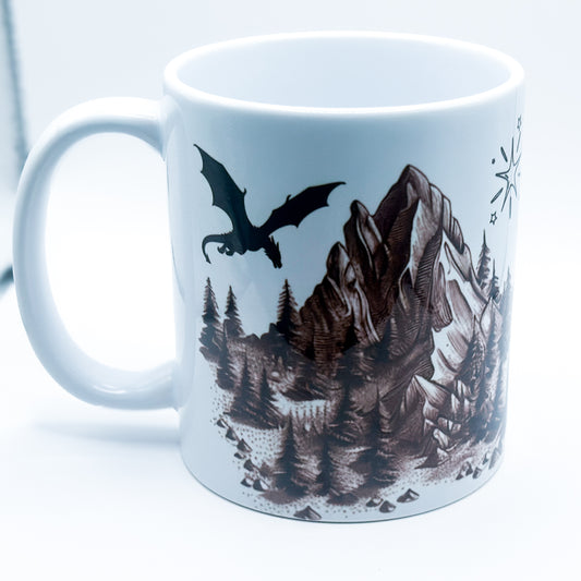 ADHD & Dragons Mug featuring a dragon flying over mountains and pine trees with stars
