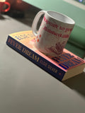 Bookish mug resting on Fever Dream by Elsie Silver, showing the quote wrap-around print with pink text and floral illustrations