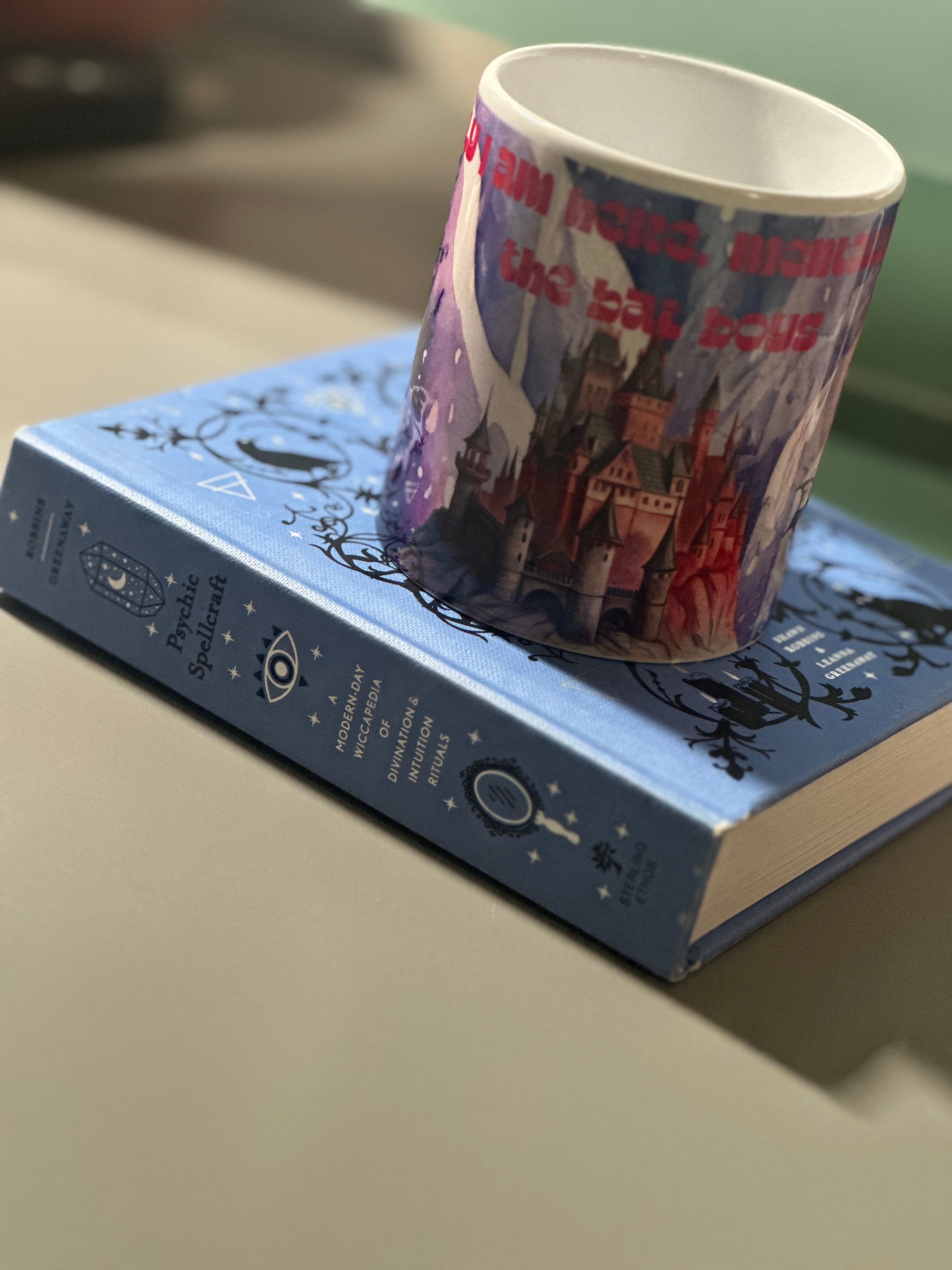 Back view of the Bat Boys mug on Psychic Spellcraft book showing full wrap-around castle and bat design